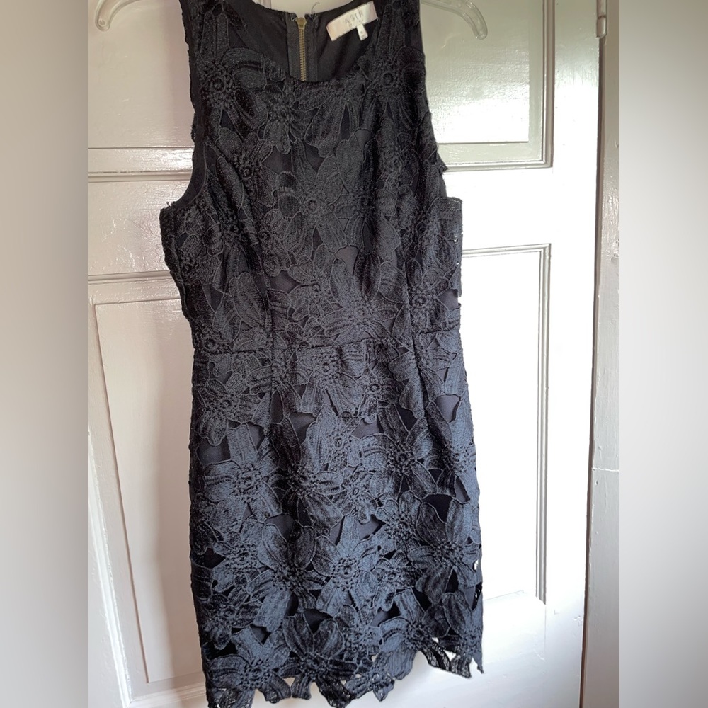 Like new. ASTR the label. Black lace mini dress. Size medium.